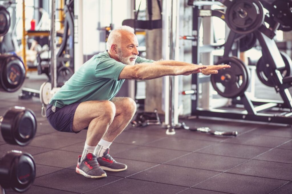 old man exercising at the gym